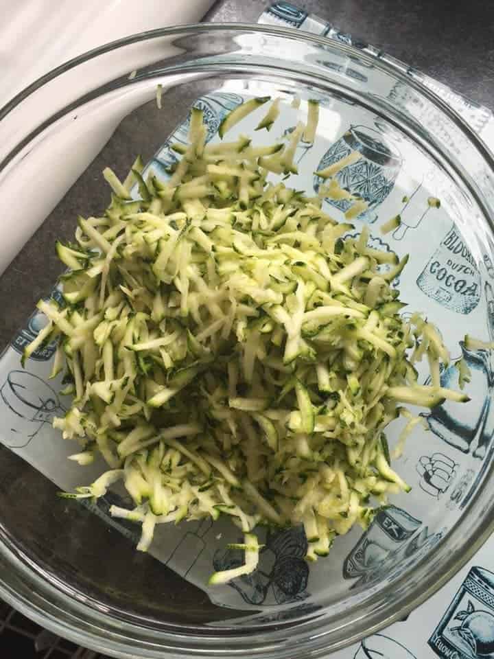 Grated courgette (zucchini) in a bowl.