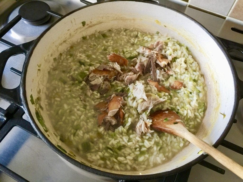 Smoked mackerel being added to the risotto.