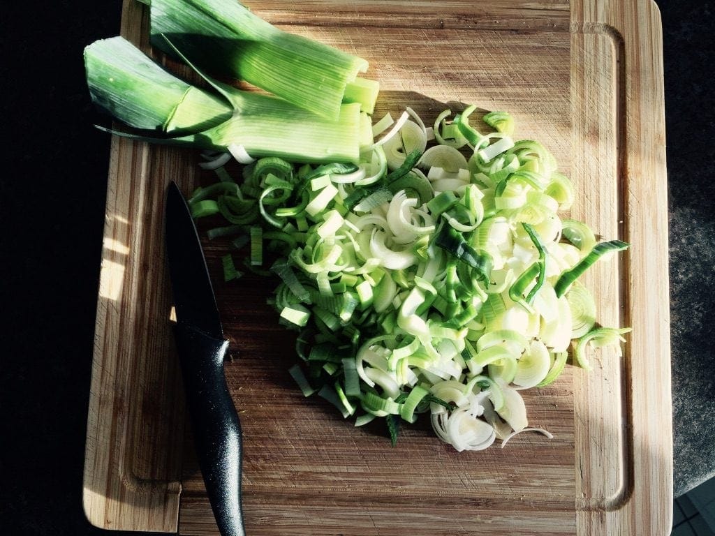 Sliced leek on the chopping board.