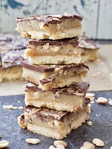 Millionaire's shortbread slices pilled up.