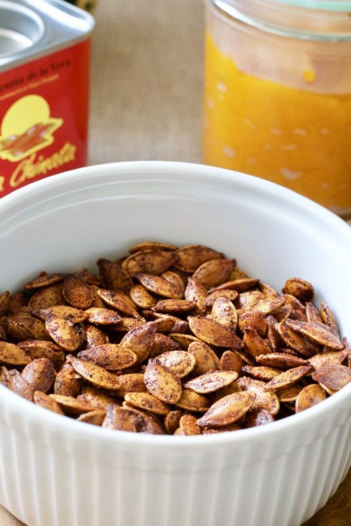 Roasted pumpkin seeds in a bowl.