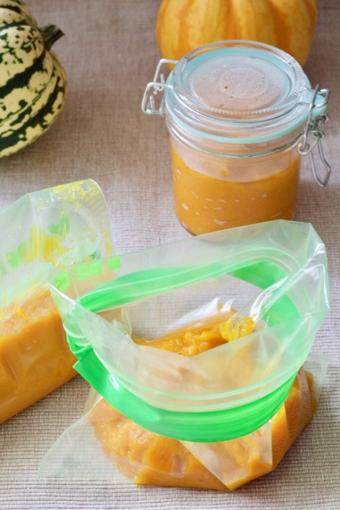 Pumpkin puree in a closed jar and in freezer bags.