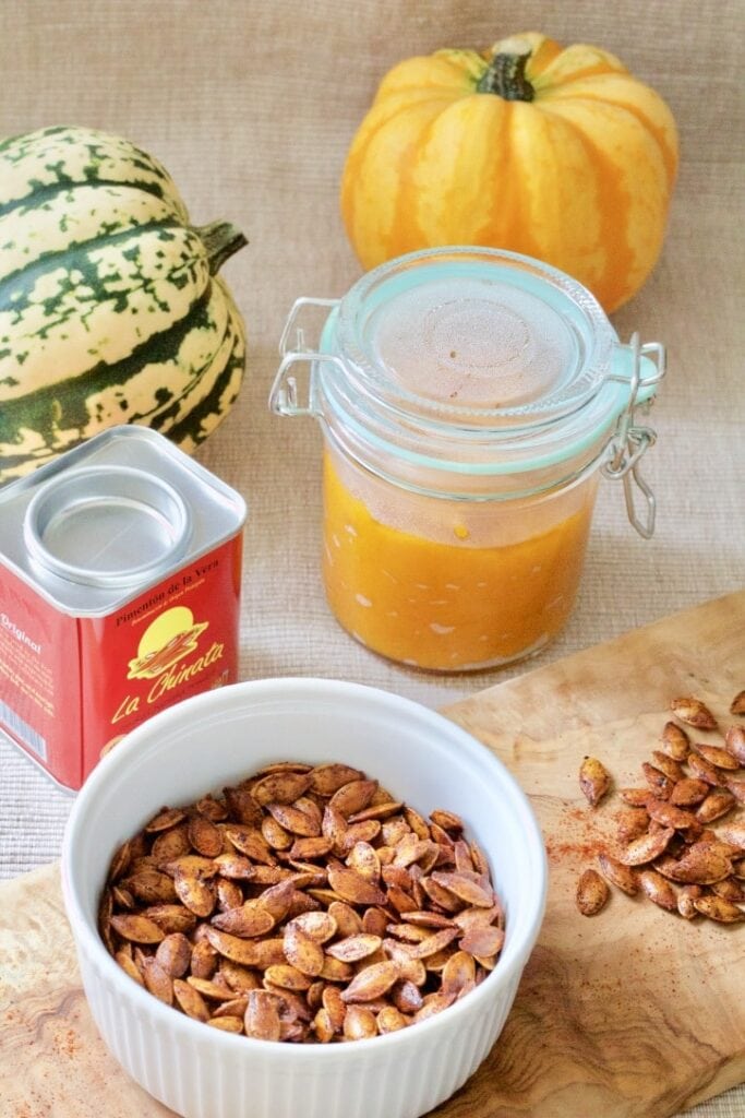 Roasted pumpkin seeds, pumpkin puree in a jar & paprika.