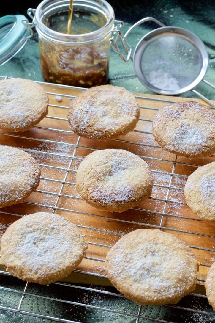 Mince pies on a cooling rack.