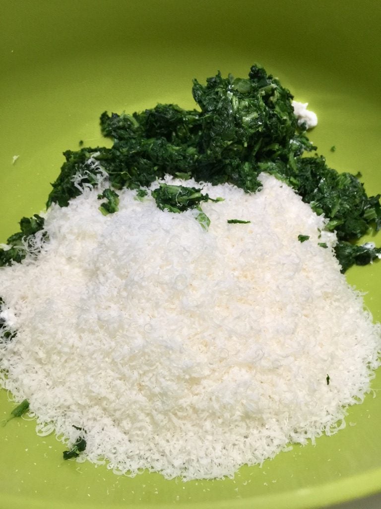 Spinach, ricotta and parmesan in a bowl.
