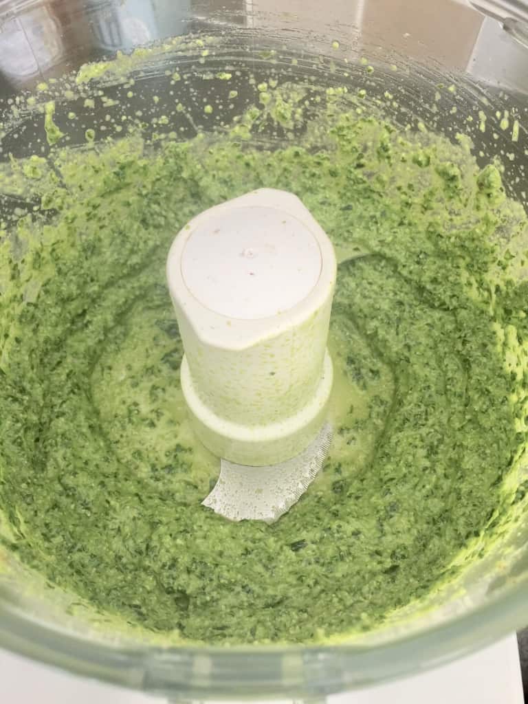 Pesto in a food processor after blending.