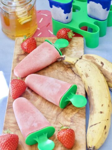 Ice Lollies on a wooden board.