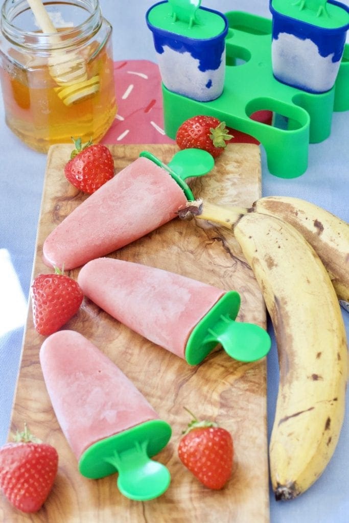 Ice Lollies on a wooden board.