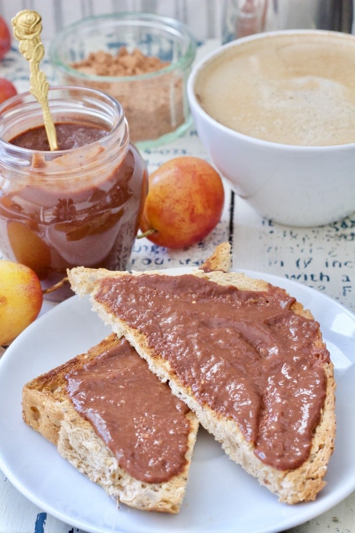 Close up of a toast with plum jam with chocolate on it.