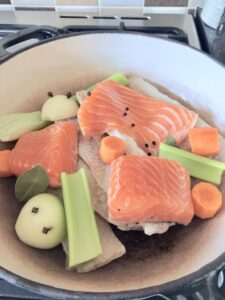 Fish & veg in a casserole dish.