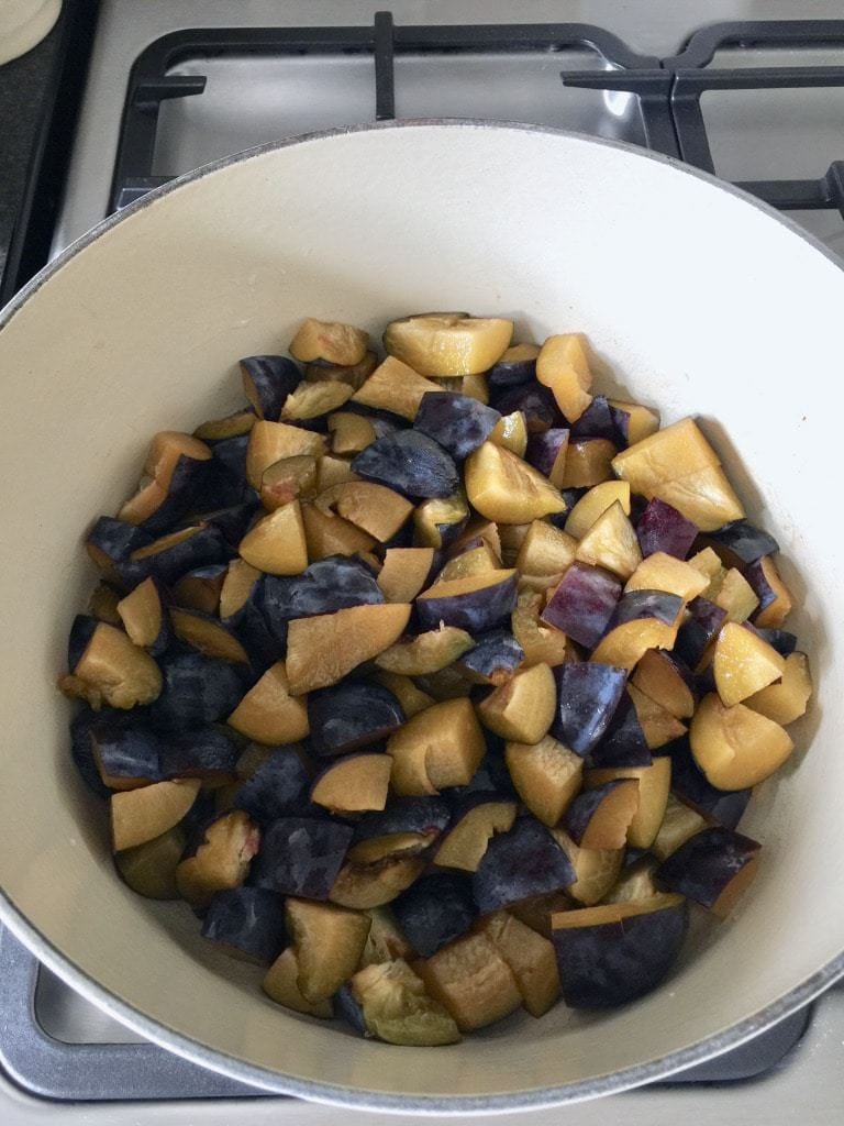 Plums in a pot.