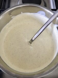 Vanilla cream infusing in a pan.