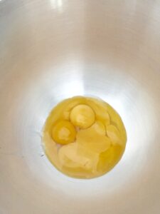Egg yolks in a mixer bowl.