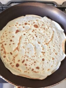 Pancake on the pan (flipped again).