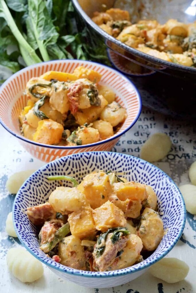 Easy Butternut Squash & Chorizo Gnocchi - close up of two portions plated up in bowls