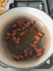 Easy Butternut Squash & Chorizo Gnocchi - pieces of chorizo frying in a pan