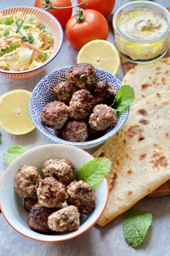 Easy Lamb Kofta Meatballs in bowls with accompaniments