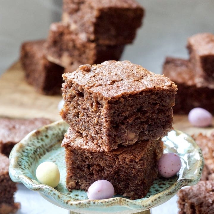 Chocolate Banana Cake on a cake stand with Mini Eggs