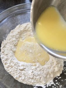Easy Flatbread (No Yeast) - butter/milk mixture being added to the flour