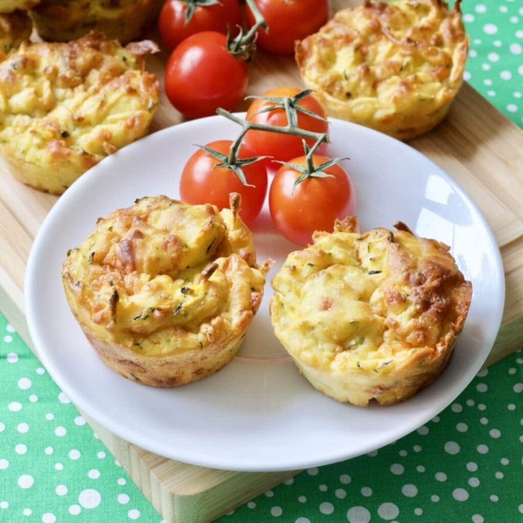 Cheesy Carrot & Courgette Savoury Muffins on a plate - close up