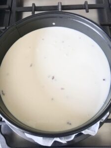 vanilla cheesecake mix in a cake tin