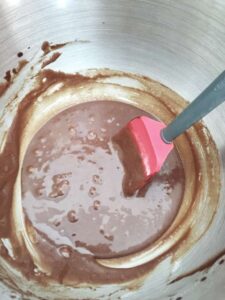 brownie mixture in a bowl with spatula