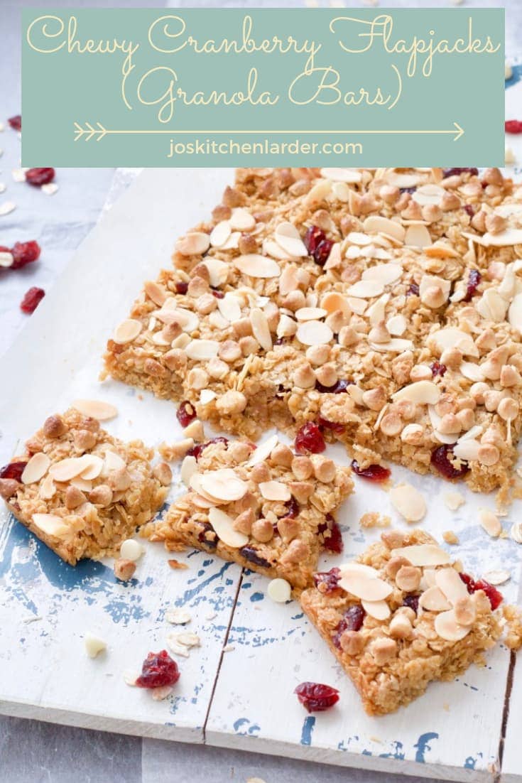 These Chewy Cranberry Flapjacks (Granola Bars) are so moreish! Sprinkled with almond flakes & white chocolate chips, they\'re real treat! They make delicious snack or even breakfast on the go! #flapjack #granolabar #cranberries #almonds #whitechocolate #snack #breakfast