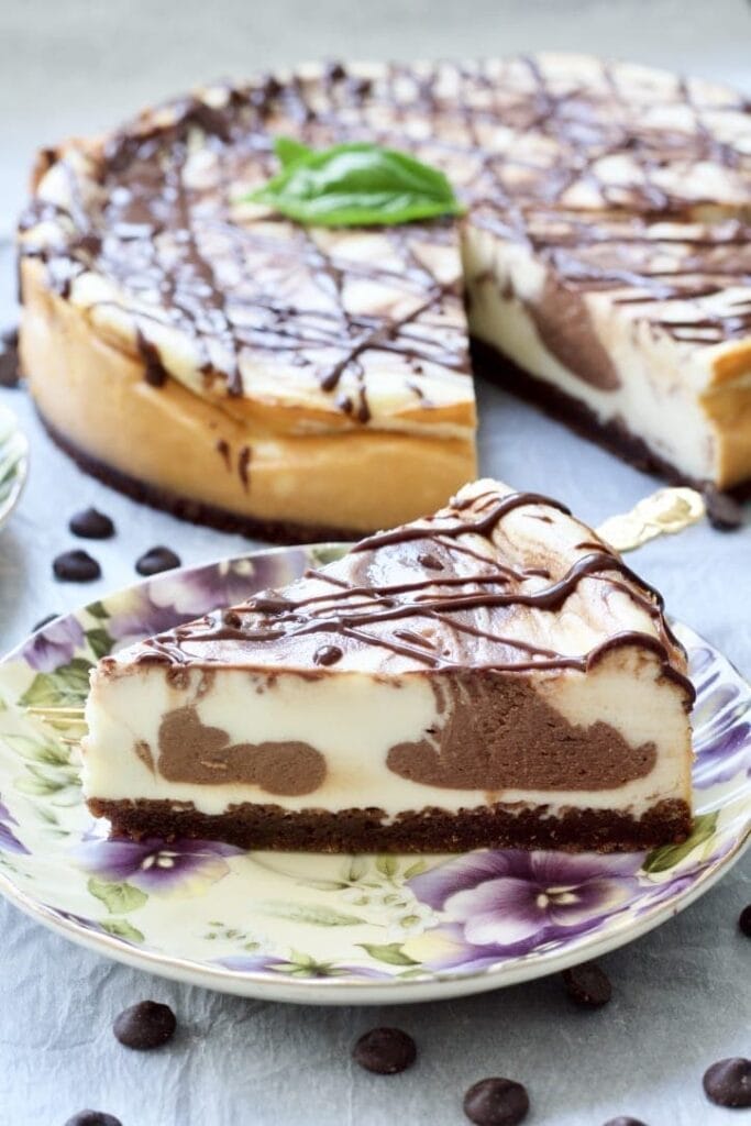 Slice of Chocolate Marble Cheesecake with Brownie Crust on a plate