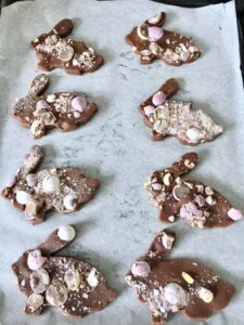 chocolate shortbread bunnies shaped cookies on baking tray