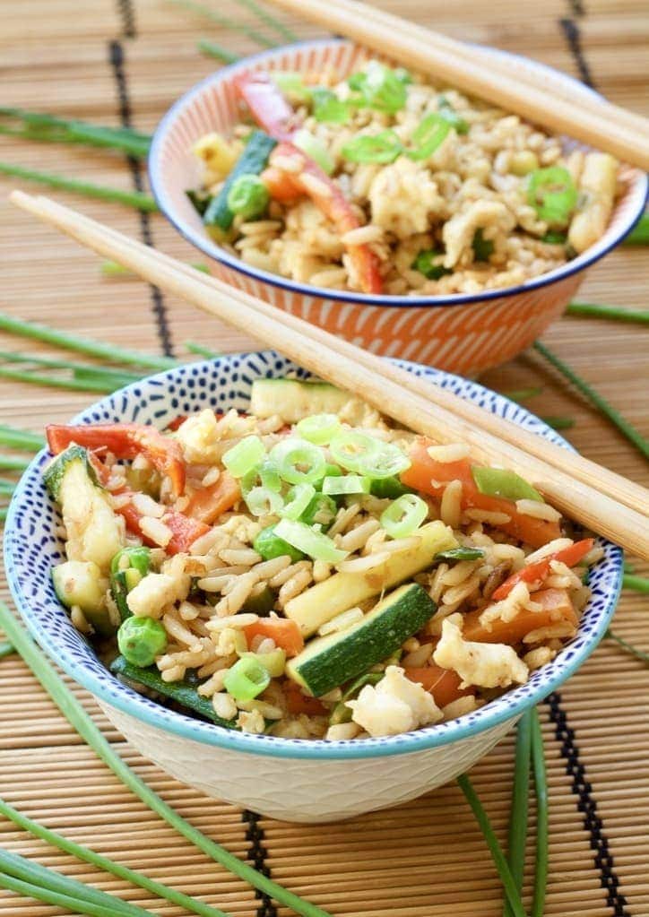 Vegetable Egg Fried Rice in a bowl with chopsticks