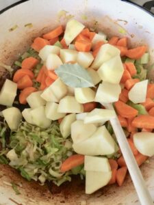 Vegetables for chicken stew in a pan