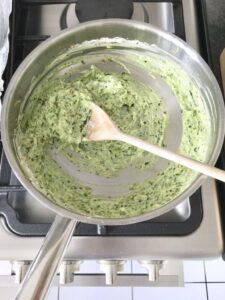 Mixture of leeks, Creme Fraiche and pesto in a pan