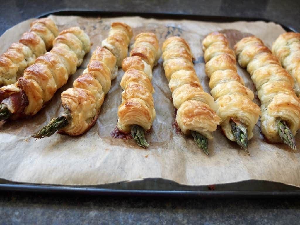 Asparagus Puff Pastry Twists on a baking tray
