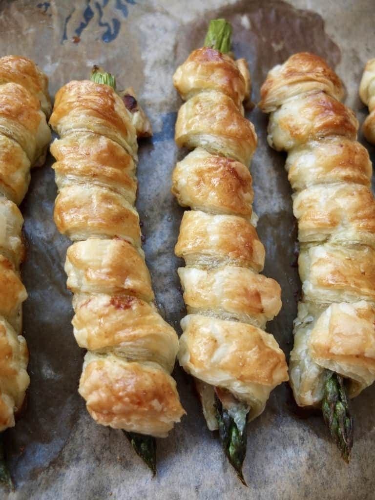 Asparagus Puff Pastry Twists on a baking tray - close up