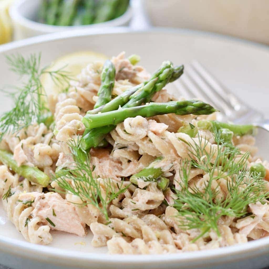 Plate with pasta & asparagus, close-up.
