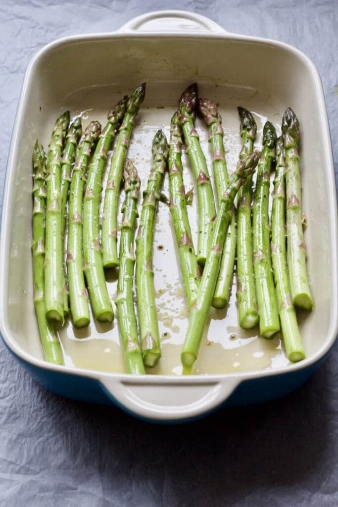 asparagus spears in a roasting dish