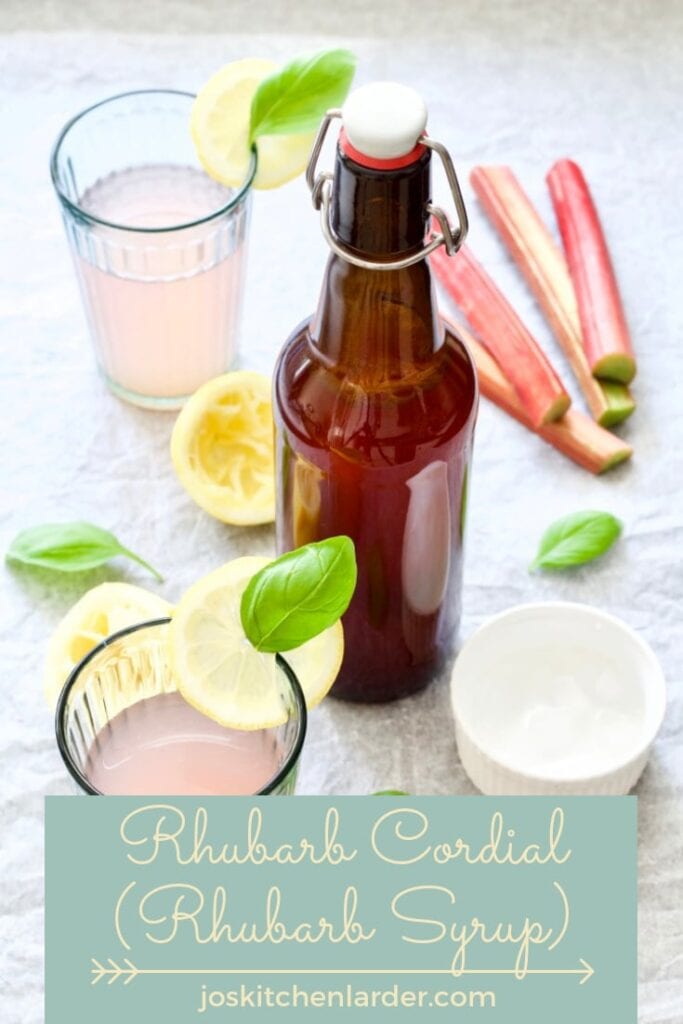 Bottle with rhubarb cordial & glasses.