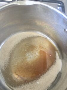 Sugar caramelising in a pan.