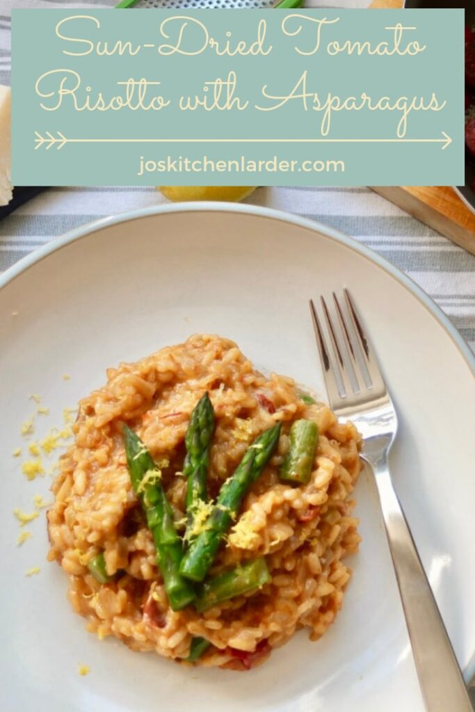 Risotto with asparagus spears on a plate.