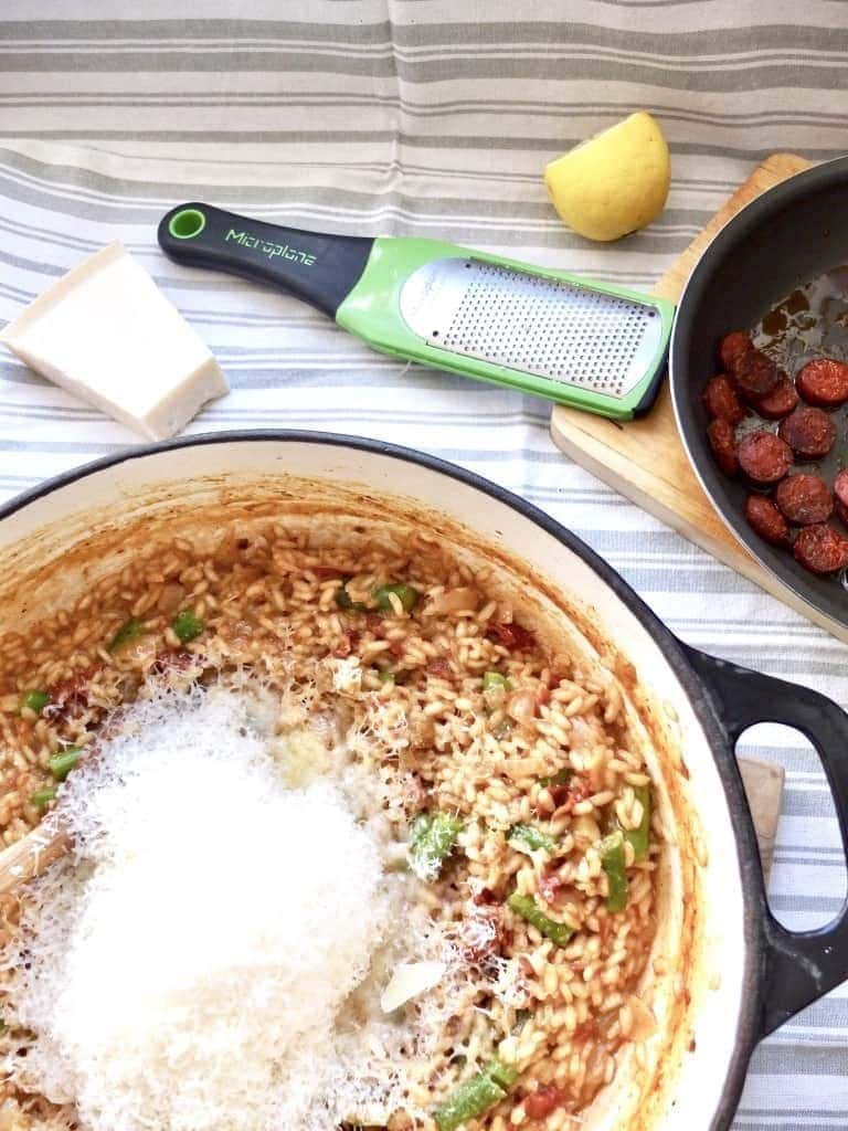 Risotto in a pan with lots of parmesan.