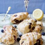 Blueberry scones with lemon glaze on the board.