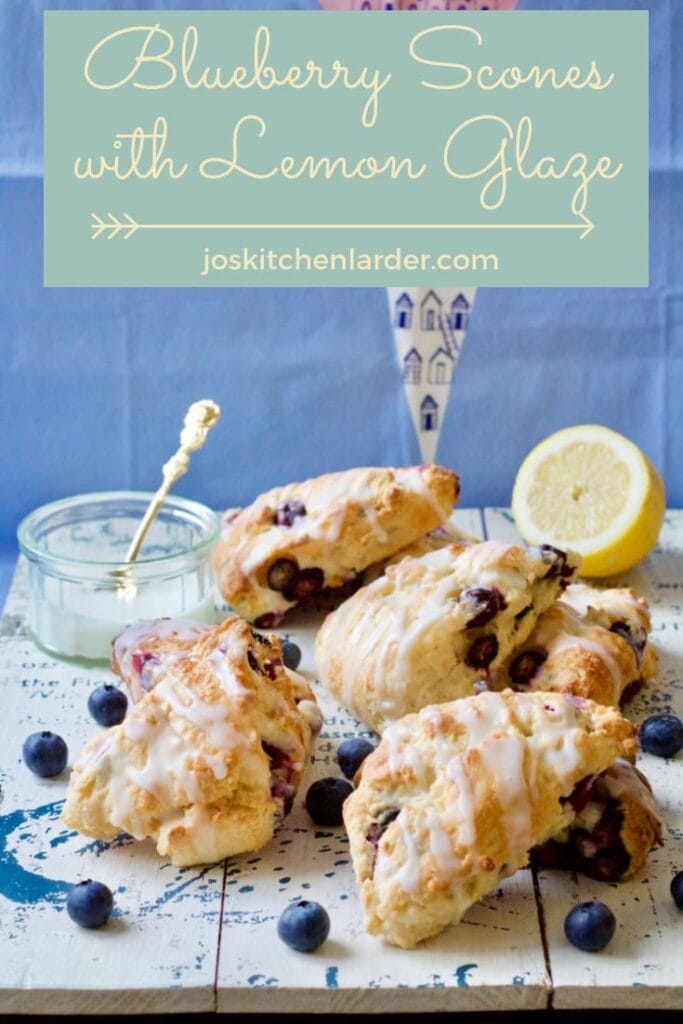 Blueberry scones with lemon glaze on the board.