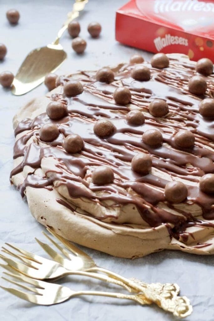 Chocolate Pavlova, cutlery & Maltesers.