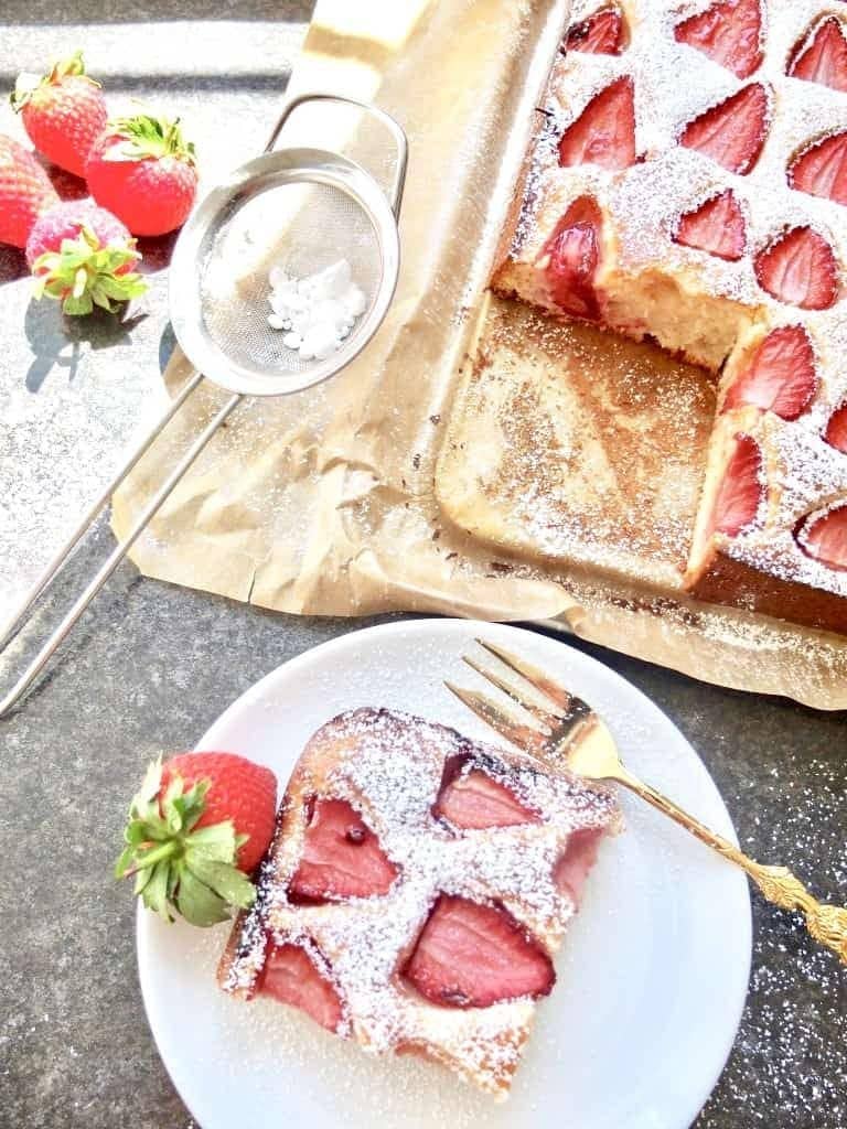 Slice of strawberry cake on a plate.