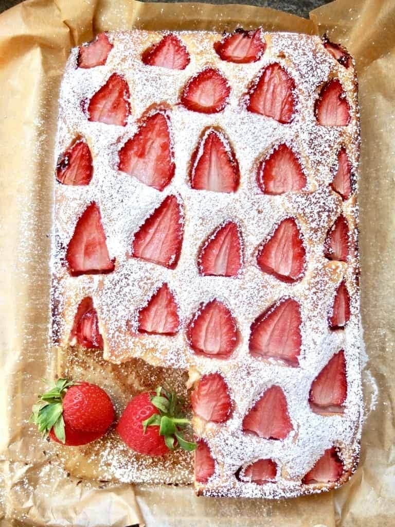 Strawberry Cake with one slice missing.