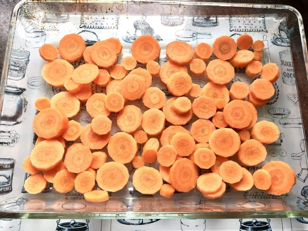 Sliced carrots in a baking dish.