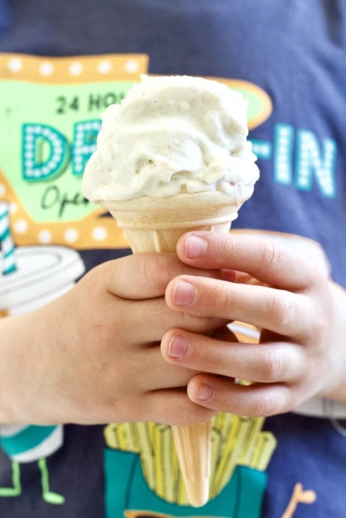 Ice cream held by a child.