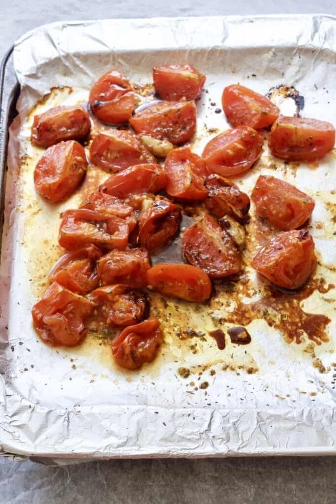 Roasted tomatoes mixed with balsamic vinegar.