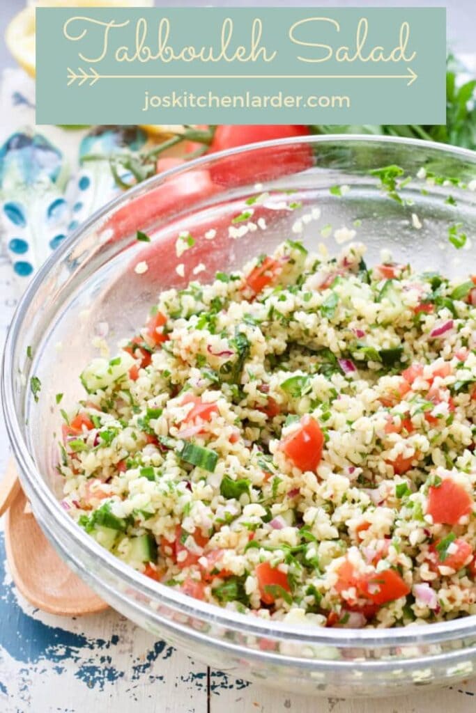 Tabbouleh salad in a glass bowl.