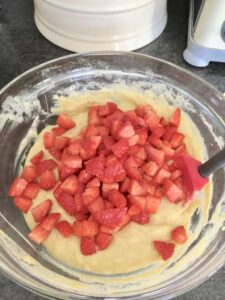 Chopped strawberries added to the muffin batter.